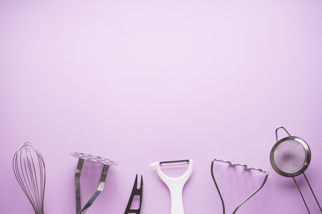 Kitchen tool in the purple background. Flat extends to the text.