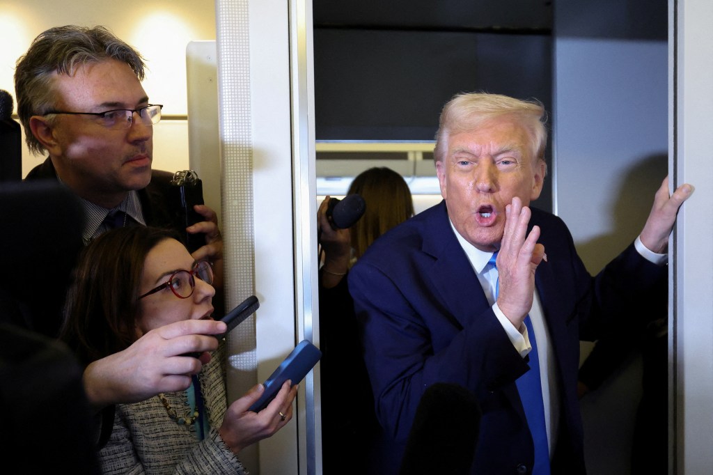 President Donald Trump talks with the media members aboard the Air Force one before landing at West Palm Beach, Florida, Sh.B., March 28, 2025.