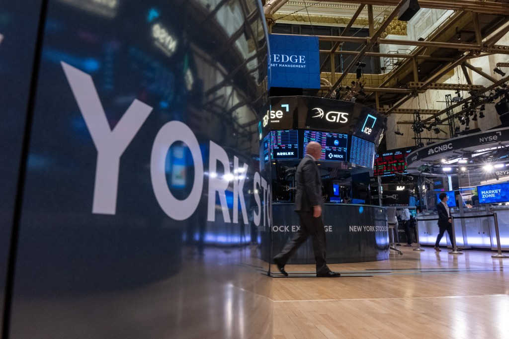 Traders work on the floor of New York Stock Exchange